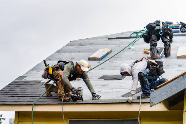Professional Roofing technician working in Queen, PA
